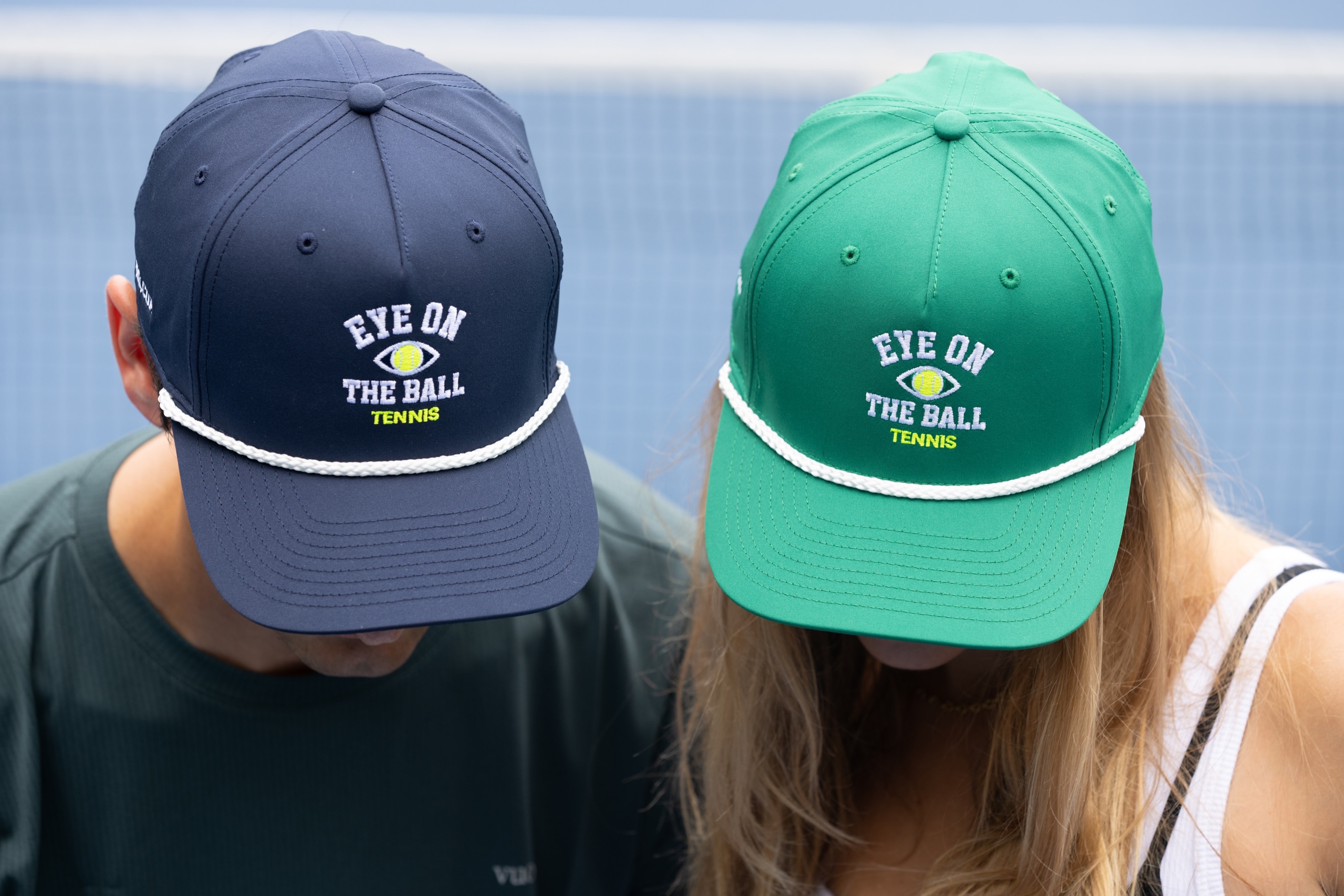 Navy and forest-green Eye on the Ball rope hats worn on court.